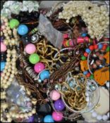 A box of assorted costume / dress jewellery to include bracelets , bangles etc.