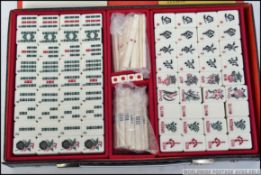 A late 20th century Mah Jong games set never being used complete with paperwork,