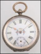 A silver early 20th century continental rococo chased ladies fob pocket watch with open face and