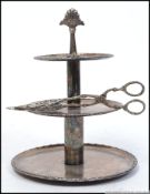 An silver plated petit four three tier cake stand along with a pair of stunning decorative cake