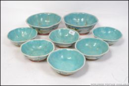A set of six decorative chinese bowls along with a pair of matching serving dishes