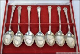 A cased set of 7 silver hallmarked spoons complete in the presentation box.