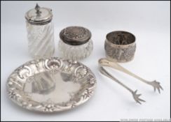 A pair of silver hallmarked sugar tongs, Birmingham date letter F.