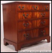 A Georgians style mahogany bachelors chest of drawers.