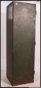 A vintage large industrial possibly military sectional locker / cupboard in green,