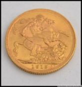 An Edwardian full George V 1912 gold sovereign weighing 8.