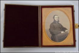 A late 19th early 20th century leather folding photograph / ambrotype style picture frame,