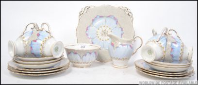 A Tuscan 6 person part tea service , printed with hand painted details.