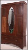 An Edwardian mahogany inlaid single wardrobe.