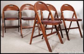 A set of 4 vintage mid century folding school / village hall chairs.