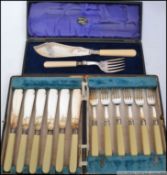 A collection of silver and silver plated items to include cased flatware, carving set, wine cooler ,