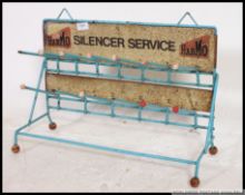 A retro 1970's Industrial shop display stand of tubular metal construction with notation for Harmo