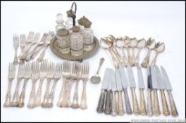 A 20th century silverplate 6 piece cut glass cruet set on stand together with a collection of