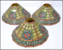 3 x 20th century Tiffany style leaded and coloured glass lamp shades,