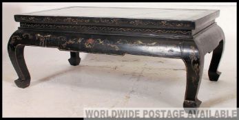A stunning Chinese lacquer and ebonised coffee table,