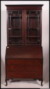 A 1930's qtr veneer mahogany bureau bookcase cabinet.