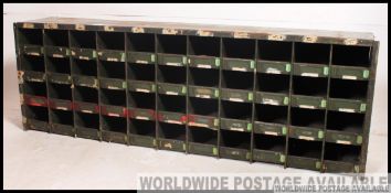 A vintage mid century industrial metal pigeon hole cabinet,