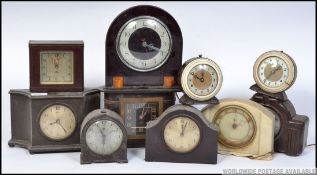 A collection of 1930's bakelite electrical mantle and alarm clocks to include Smiths, Ferranti,