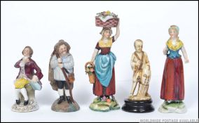 A group of miniature figurines to include Naples marked continental lady and lady with basket