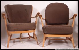 A pair of 1970's retro Ercol Golden Dawn beech and elm Windsor pattern armchairs.