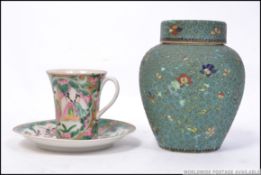 A Chinese / Canton 19th century cup and saucer together with a chinese enamel painted ginger jar
