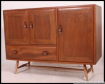 An Ercol Windsor pattern sideboard.