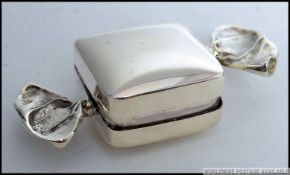 A white metal 925 silver pill / snuff box in the form of a wrapped sweet. Stamped 925.