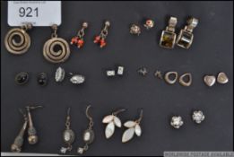 A collection of fourteen matching pairs of earrings to include stud, drop,