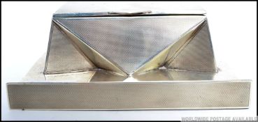 A stunning Art Deco silver hallmarked twin capstan inkwell.