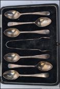 A cased set of 6 silver hallmarked spoons and sugar tongs complete in the presentation box.