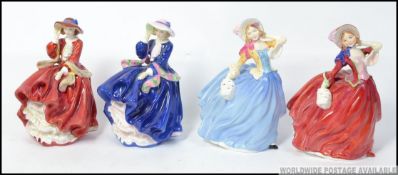 A group of 4 Royal Doulton figures to include Autumn Breeze HN1934 and Autumn Breeze HN3736 Michael