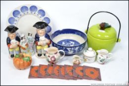 A collection of ceramics to include a large biscuit barrel in the form of an apple,