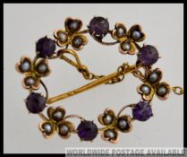 A 9ct antique amethyst and seed pearl brooch.
