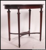 An Edwardian mahogany inlaid oval shaped side table.