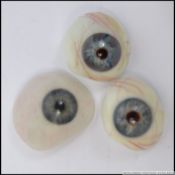 3 surgical glass replacement eyes by Jost Haas of London.