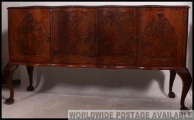 A good quality 1930's Queen Anne revival walnut serpentine fronted sideboard dresser.