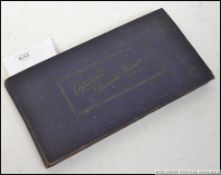 A vintage cigarette card album ' Cigarette Picture Album ' containing several cards - Players