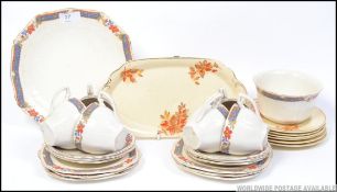 A vintage chintzy floral tea service by Alfred Meakin,