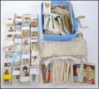 A shoe box of cigarette cards dating from the early part of the 20th century to include many