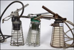 A collection of retro mid century trouble lamps / cage inspection lamps,