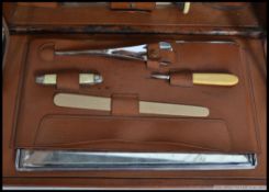 An early 20th century Edwardian gentlemen's leather Vanity travelling case with ivory brushes and