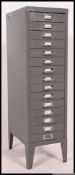 A retro 20th century Industrial grey metal 15 drawer filing office cabinet with chrome loop handles