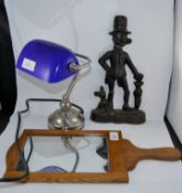 A mid century Opticians eye test paddle and mirror together with a cast iron doorstop and a bankers