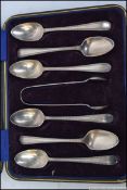 A cased set of 6 silver hallmarked spoons and sugar tongs complete in the presentation box.