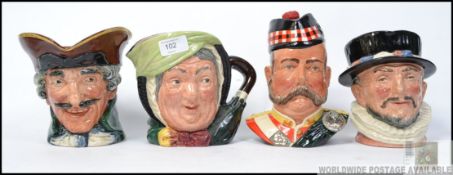 A group of 4 Royal Doulton character toby jugs to include Beefeater D6206 , Sairey Gamp D5528 ,