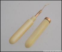 A beautiful Victorian Ivory and gold banded tooth pick.
