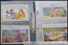 DONALD McGILL; Saucy seaside type COMIC postcards in album. 85 in total.