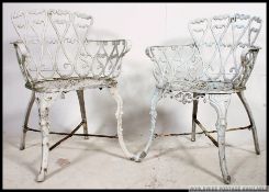 2 20th century cast metal painted garden chairs in the Coalbrookdale style.