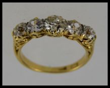 A stunning 18ct gold 5 stone diamond ring approx 2cts raised on a gypsy setting. 4.