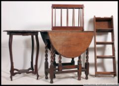 A 1930's oak drop leaf dining table together with a Victorian mahogany lamp table,